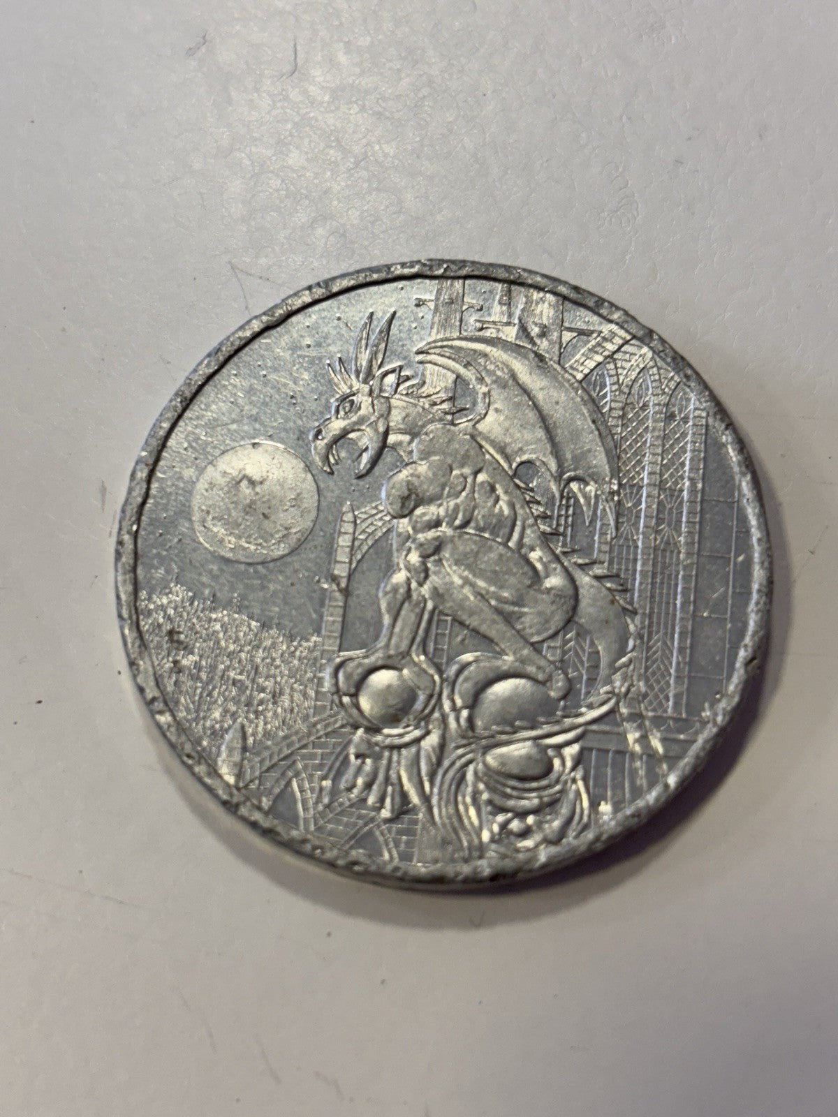 1990s American game caps aluminum pog slammer heavy metal. Dragon gargoyle