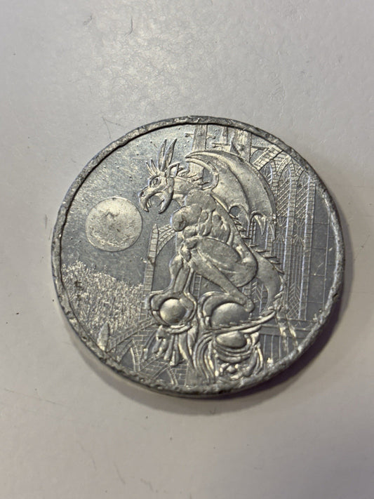 1990s American game caps aluminum pog slammer heavy metal. Dragon gargoyle